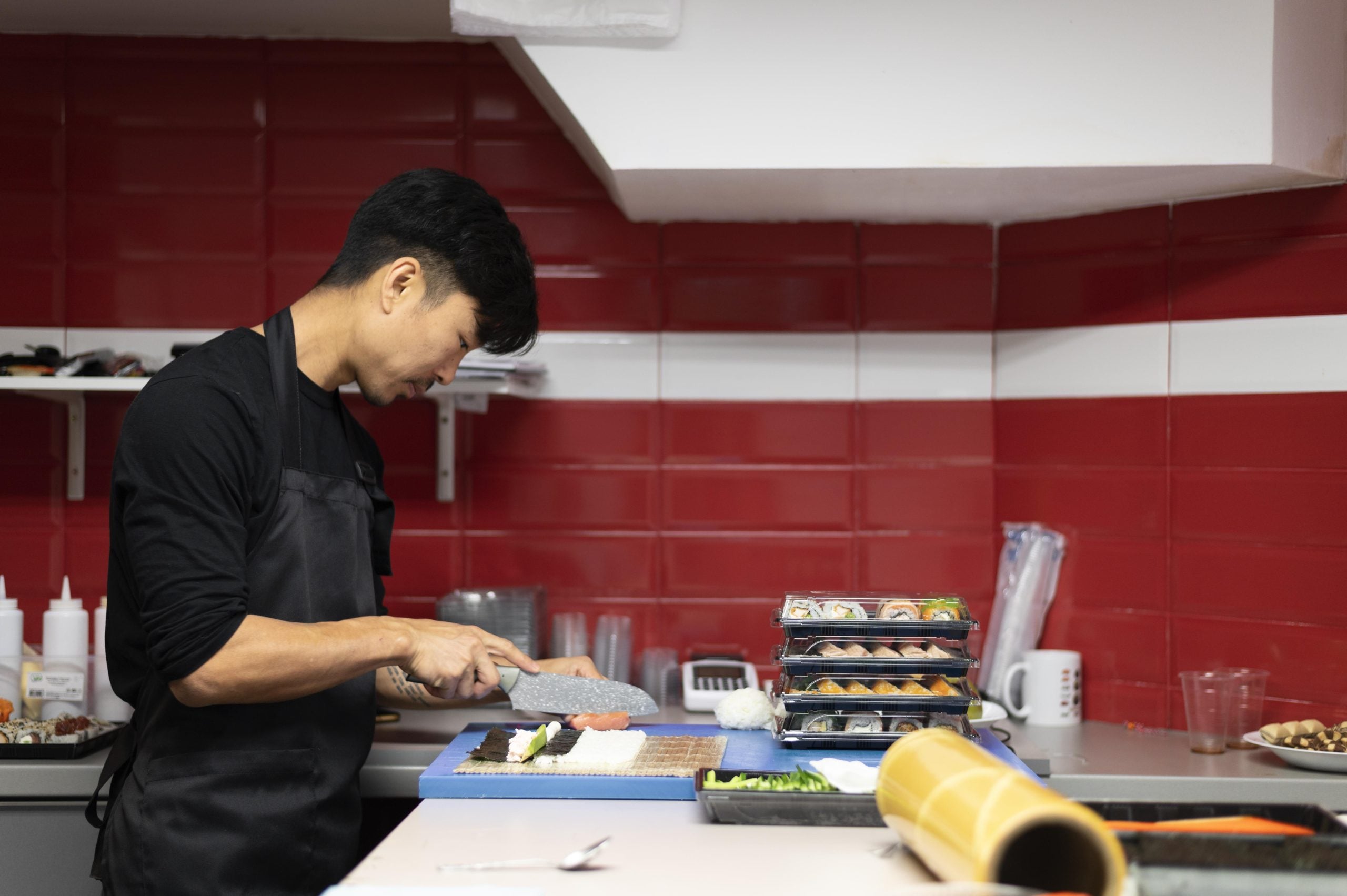man preparing sushi order takeaway 1 scaled
